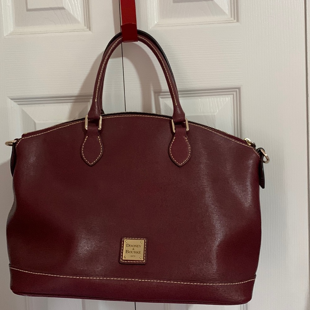 Absolutely stunning bag. Clean inside and out. Tinny tiny scuff mark on bottom